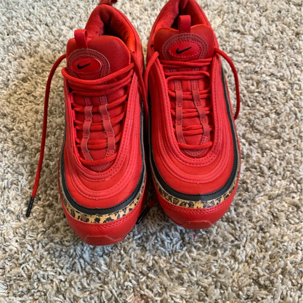 Nike Women’s Red Athletic Shoes with Black and Gold Accents